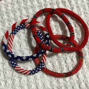 5  Sashka Co handcrafted glass bead bracelet lot. Reds. Approx 8”. Roll on.